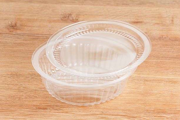 istock Plastic food package on wooden background 599142076