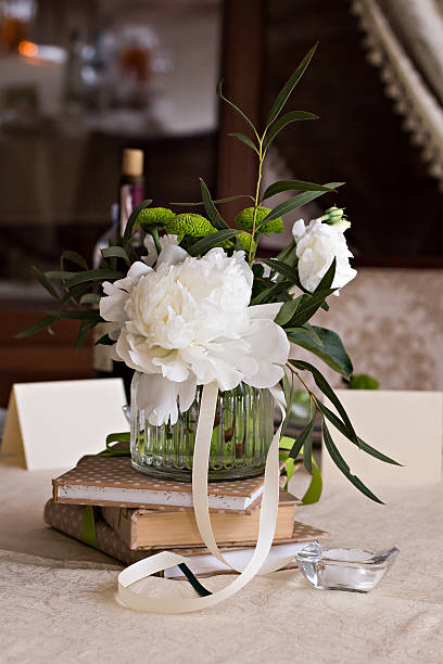 istock bouquet of white flowers. wedding table decor. 599143566