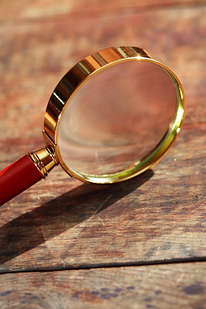 istock Magnifying Glass On Wood 599143618