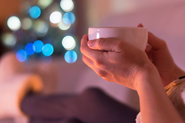 istock Woman at home drinking tea. It's Christmas 599143648