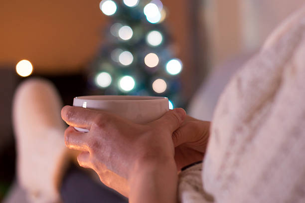 istock Woman at home drinking tea. It's Christmas 599143760