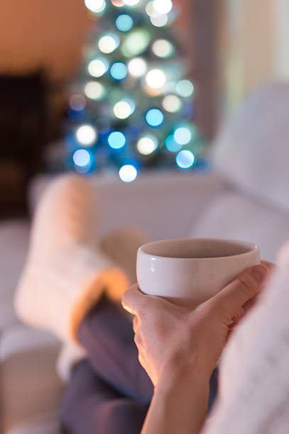 istock Woman at home drinking tea. It's Christmas 599143850