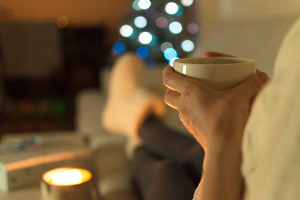 istock Woman at home drinking tea. It's Christmas 599143968