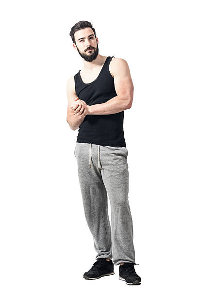 istock Skeptical athlete in sportswear with clasped hands looking at camera 599145004
