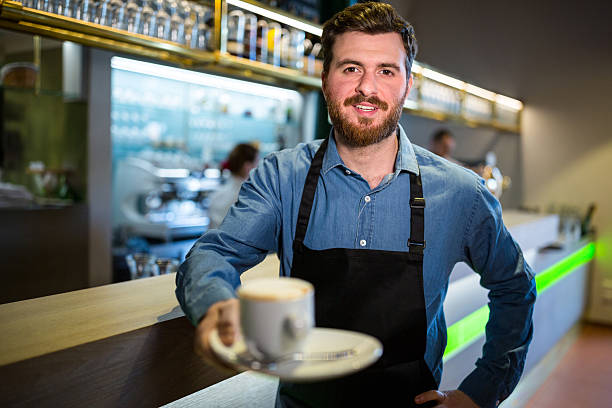 istock Waiter offering cup of coffee 599146280