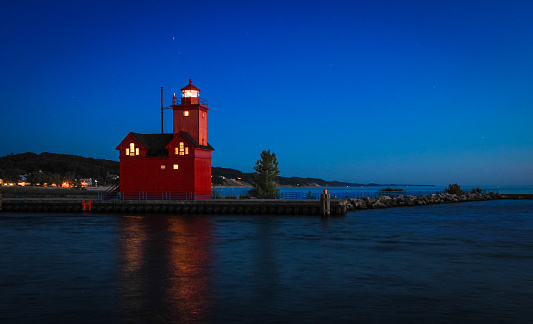 The lighthouse in Holland, Michigan, known as Big Red. The current lighthouse was built in 1907, and the architecture reflects the Dutch influence from the surrounding area. Holland, Michigan.