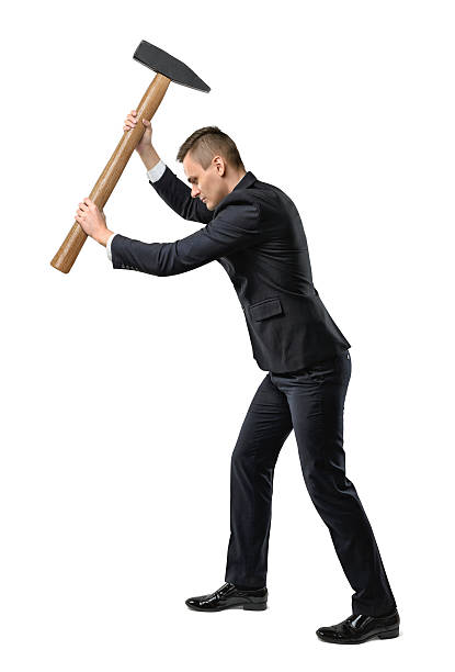 istock Businessman raising a big mallet 599146768