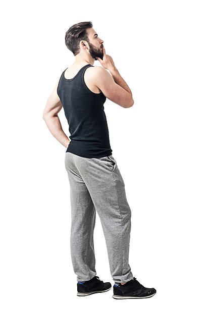 istock Side view of man in undershirt with hand on chin 599236150