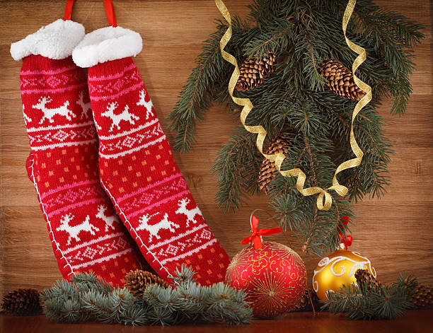 istock Christmas stocking with pine cones and branches. Xmas decorations closeup 599246538