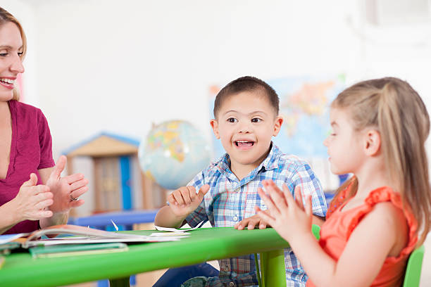 istock Down Syndrome child playing in preschool 599248378