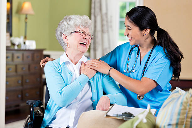 istock Friendly nurse with senior female patient 599249958