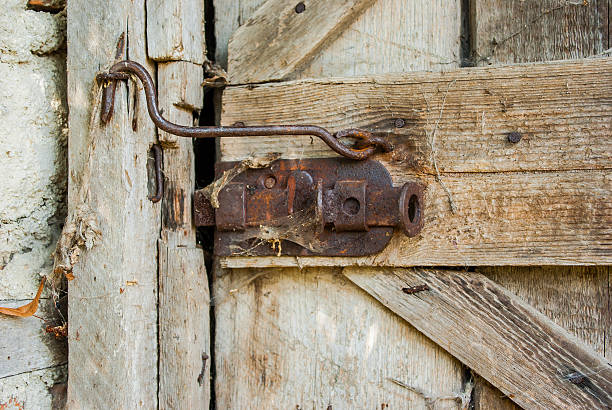 istock Old wood door with padlock 599252688