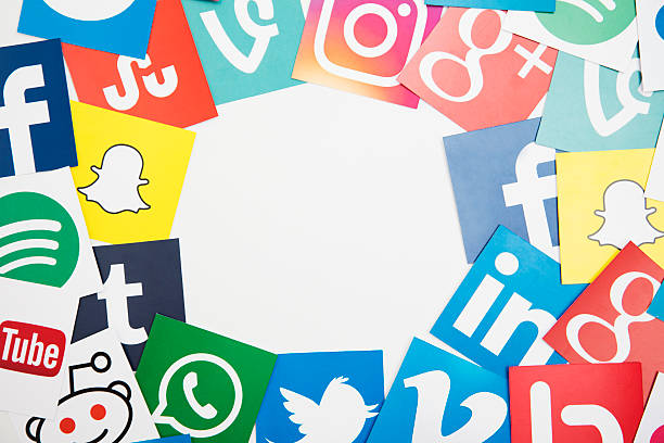 London, United Kingdom - September 5, 2016: Popular social media logos printed onto paper. Social media apps and websites allow people to communicate and share within virtual global communities
