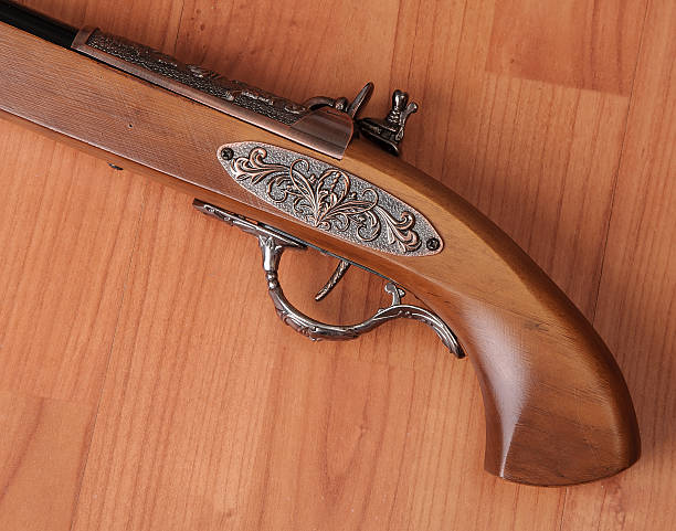 istock Vintage pistols on wooden background 599254624