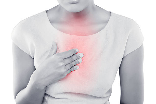 Acid reflux Woman suffering from acid reflux or heartburn heartburn photos stock pictures, royalty-free photos & images