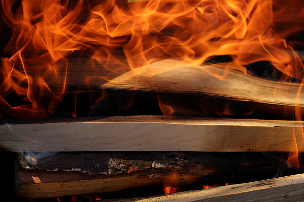 istock Flames on wood in dark 599255662