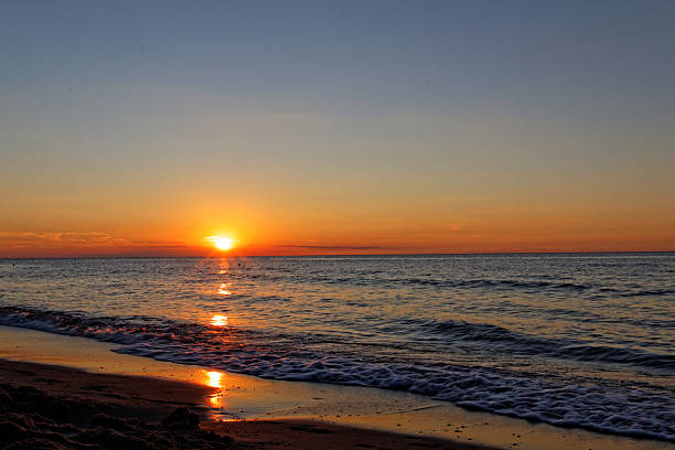 istock Orange sunset on the beach. Baltic Sea. 599255910