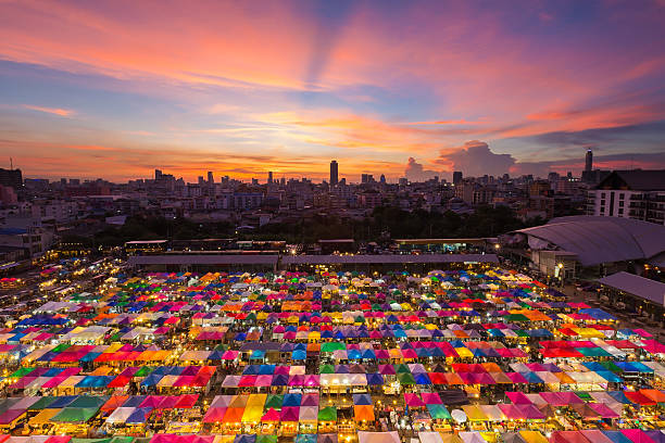 istock Aerial view, multiple colours night market rooftop 599257122