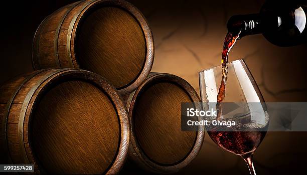 Pouring Wine In Cellar Stock Photo - Download Image Now - Wine Cask, Alcohol - Drink, Barrel