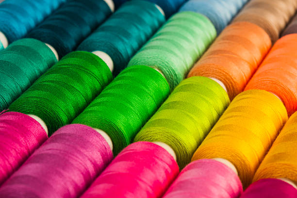 The sewing background The sewing threads multicolored background close up thread sewing item stock pictures, royalty-free photos & images
