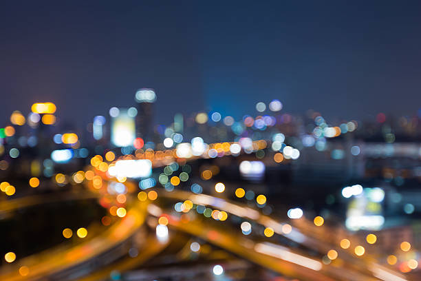 istock Blurred lights night view city and highway interchanged at twilight 599261448