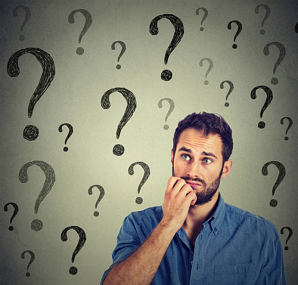 istock Thinking business man looking up has many questions 599265360