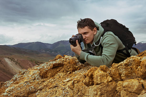 istock Man photographer camera mountains concept 599266986