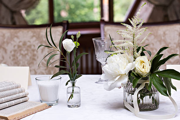 istock bouquet of white flowers. wedding table decor. 599267280