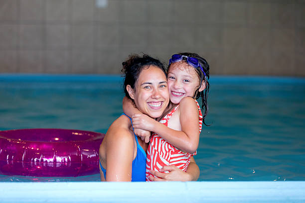 istock Young ethnic mother posing with her daughter in a 599269268