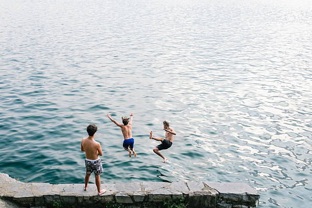 istock Two man diving in the water 599269470