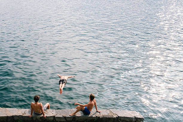 istock Man jump and dive in the water 599269496