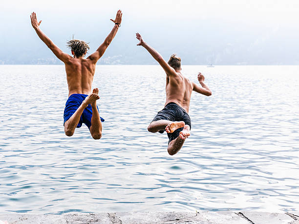 istock Two man diving in the water 599269584