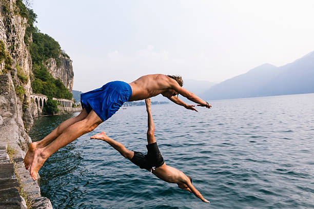 istock Two man diving in the water 599269640