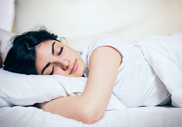 istock Young Beautiful Woman Sleeping 599271366