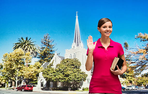 istock Smiling worshiper waving hand outdoors 599273942