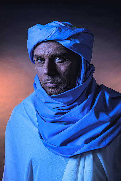 istock Berber man in night light wearing blue turban. 599275286