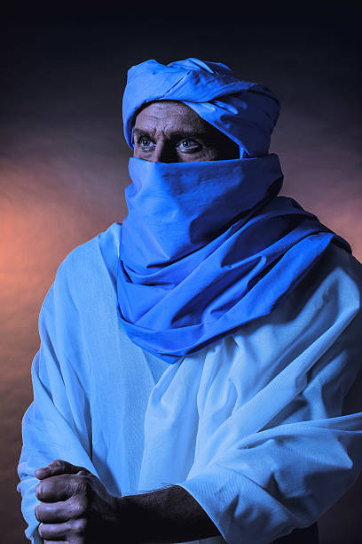 istock Berber man in night light wearing blue turban. 599275484