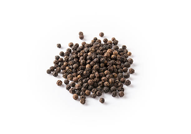 istock Pile of dried black peppercorns 599275888