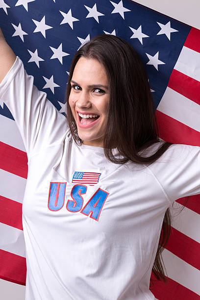istock American fan holding USA flag 599276104
