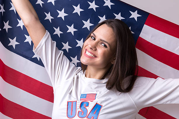 istock American fan holding USA flag 599276182