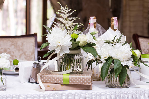 istock bouquet of white flowers. wedding table decor. 599277202