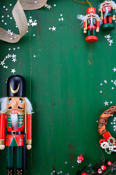 istock Christmas background with ornaments on green wood table. 599277752