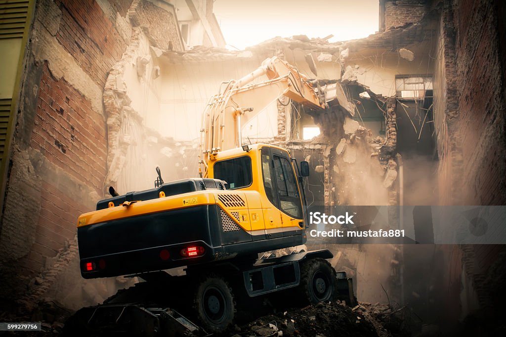 excavator demolition excavator demolition work machine Demolishing Stock Photo