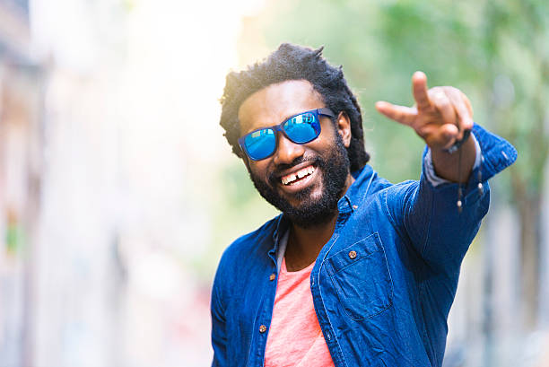 istock Handsome African Young Man Making The Victory Sign. 599282920