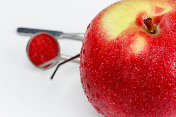 istock Tools for dental treatment and diagnosis. apple. 599283062