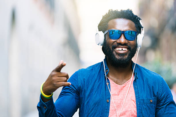istock African Young Man Listening Music. 599283084