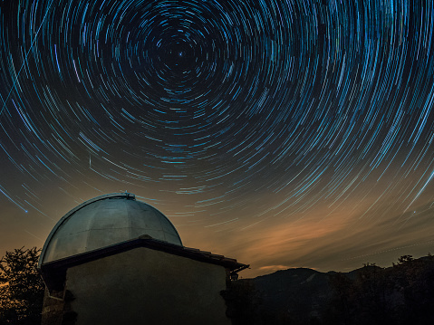 Astronomical Observatory At Night - Star Trail On The Background