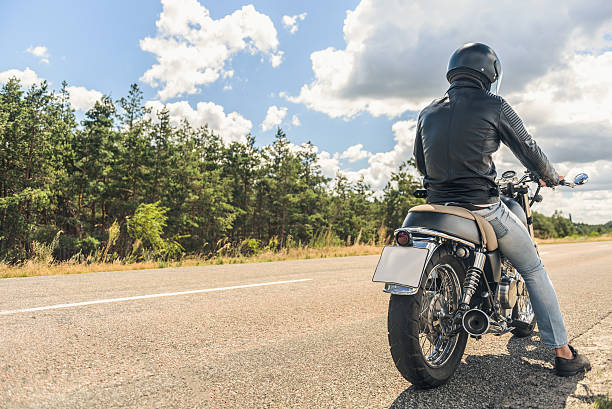 istock Young man sitting on his motorbike 599461586