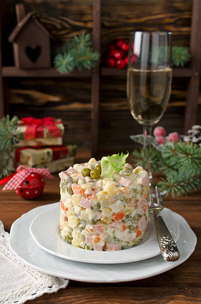 istock Russian traditional salad Olivier with vegetables and meat 599462480