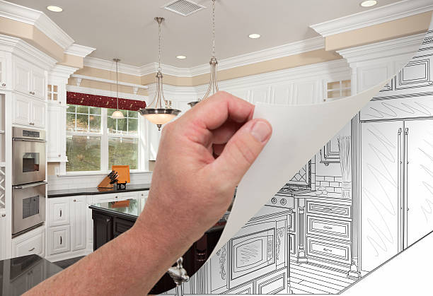 istock Hand Turning Page of Custom Kitchen Photograph to Drawing 599463372